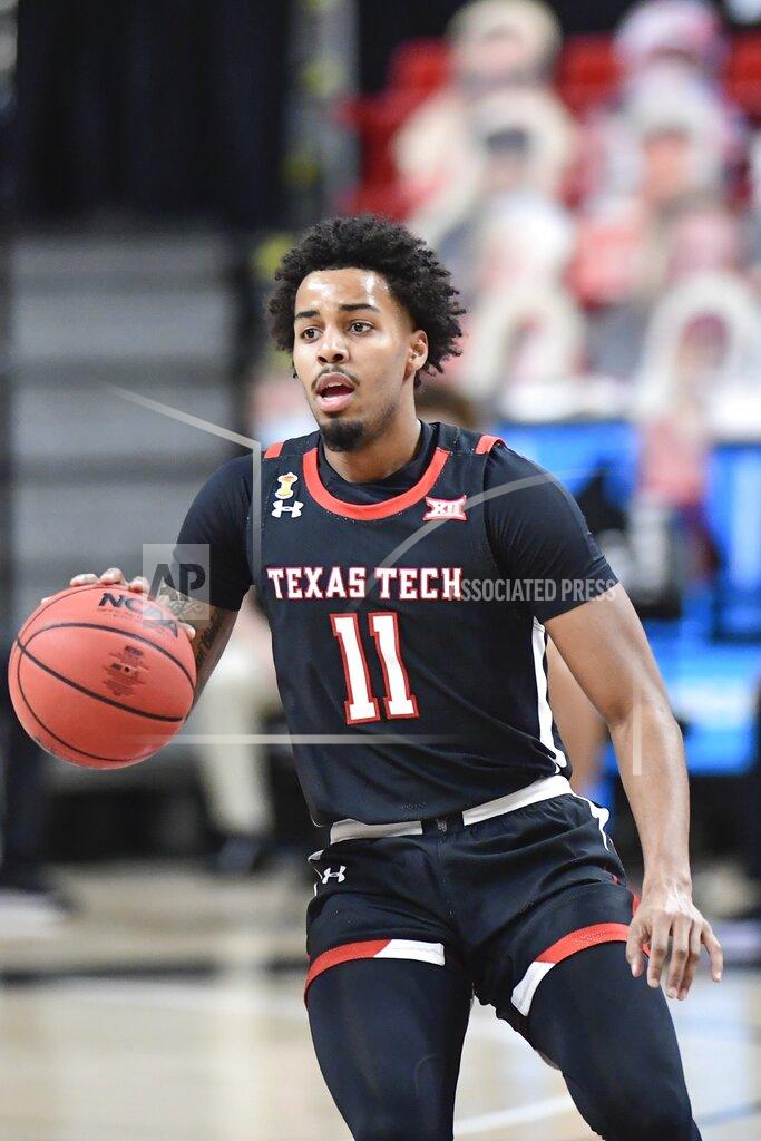 Justin Rex Texas Tech's Kyler Edwards (11) dribbles the ball down the court during the first half of an NCAA college basketball game against Baylor in Lubbock, Texas, Saturday, Jan. 16, 2021. (AP Photo/Justin Rex)