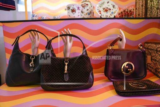 Vintage Gucci bags are displayed inside the new on-line concept store, called Gucci Vault, featuring refurbished vintage Gucci pieces and collections by young designers. The project was presented in Dazio del Ponente in Milan's Parco Sempione, where a sampling of the items on sale were displayed during the Milan Fashion Week, in Milan, Italy, Saturday, Sept. 25, 2021. (AP Photo/Luca Bruno)