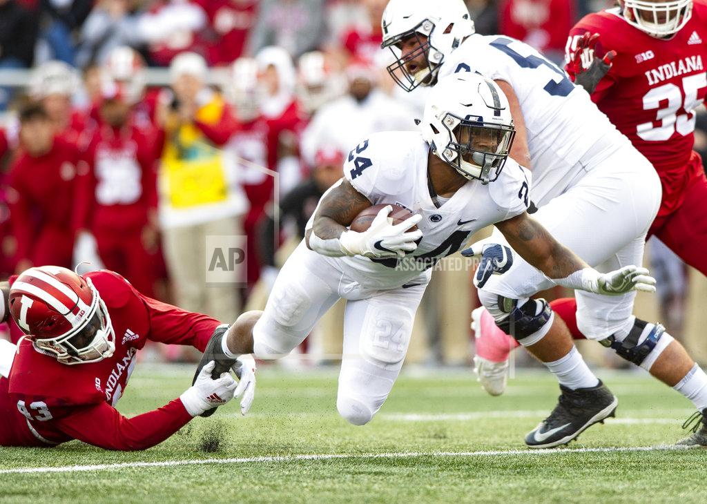 Doug Mcschooler Penn State running back Miles Sanders (24) is tripped up by Indiana linebacker Dameon Willis Jr. (43) as he rushes the ball up field during the second half of an NCAA college football game Saturday, Oct. 20, 2018, in Bloomington, Ind. Penn State won 33-28. (AP Photo/Doug McSchooler)