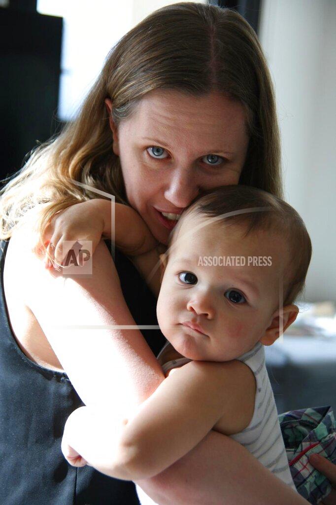 Ian Copland Sarah Copland hugs her son Isaac, who was killed in the Aug. 4, 2020 explosion at the Beirut port, in Melbournes, Australia, in May, 2019. A shard of glass tore through the tiny chest of her two-year-old son, Isaac, ending his short life and that day, she said, her life came to a standstill. Many of those who lived through it struggle with depression or symptoms of post-traumatic stress. (Ian Copland via AP)