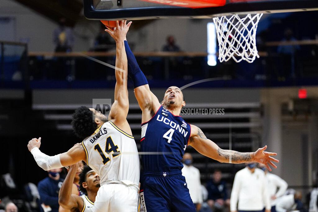 Matt Slocum Connecticut's Tyrese Martin (4) goes up for a shot against Villanova's Caleb Daniels (14) during the second half of an NCAA college basketball game, Saturday, Feb. 20, 2021, in Villanova, Pa. (AP Photo/Matt Slocum)