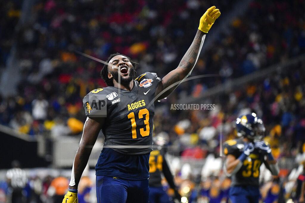 John Amis North Carolina A&T wide receiver Elijah Bell comes off the field celebrating after the first half of the Celebration Bowl NCAA college football game against Alcorn State, Saturday, Dec. 21, 2019, in Atlanta. North Carolina A&T won 64-44. (John Amis/Atlanta Journal-Constitution via AP)