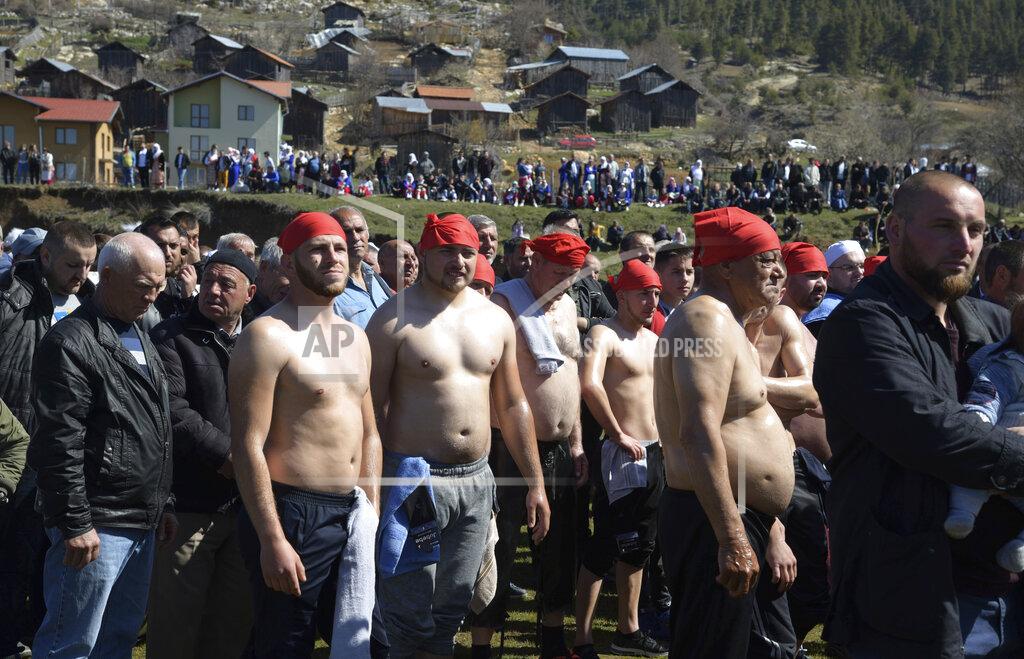 Jordan Simeonov Bulgarian muslims walk in a procession during circumcision ceremony in the village of Ribnovo, Bulgaria, Sunday, April 11, 2021. Despite the dangers associated with COVID-19 and government calls to avoid large gatherings, Hundreds of people flocked to the tiny village of Ribnovo in southwestern Bulgaria for a four-day festival of feasting, music and the ritual of circumcision which is considered by Muslims a religious duty and essential part of a man's identity. (AP Photo/Jordan Simeonov)
