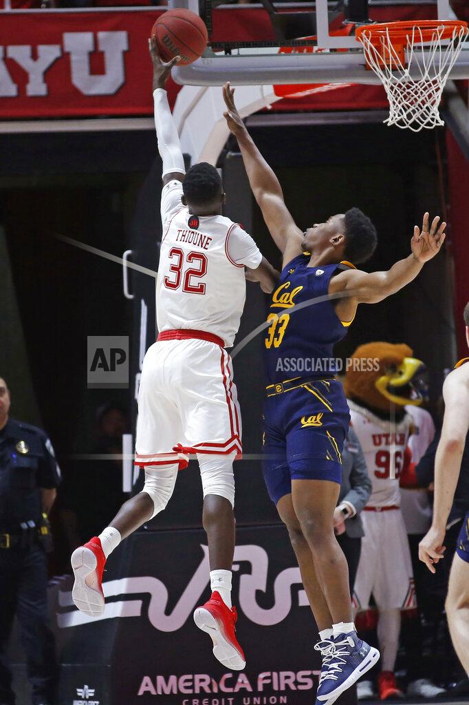 Rick Bowmer Utah center Lahat Thioune (32) lays the ball up as California forward D.J. Thorpe (33) defends during the first half of an NCAA college basketball game Saturday, Feb. 8, 2020, in Salt Lake City. (AP Photo/Rick Bowmer)