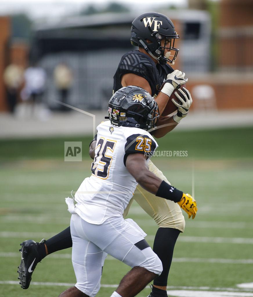 Nell Redmond Wake Forest wide receiver Sage Surratt makes a catch against Towson defensive back Terrill Gillette in the first half of a NCAA college football game in Winston-Salem, N.C., Saturday, Sept. 8, 2018. (AP Photo/Nell Redmond)
