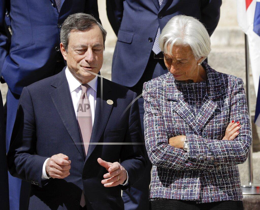 Andrew Medichini FILE - In this Saturday, May 13, 2017 file photo, President of the European Central Bank Mario Draghi, left, and International Monetary Fund Managing Director Christine Lagarde share a word in Bari, southern Italy. Italy's weary president on Wednesday, Feb. 3, 2021 tapped "Super Mario," arguably the world's most famous Italian, to resolve a festering political crisis that threatens the ability of the eurozone's third-largest economy to manage the coronavirus pandemic and recover from the worst recession since World War II. (AP Photo/Andrew Medichini, File)