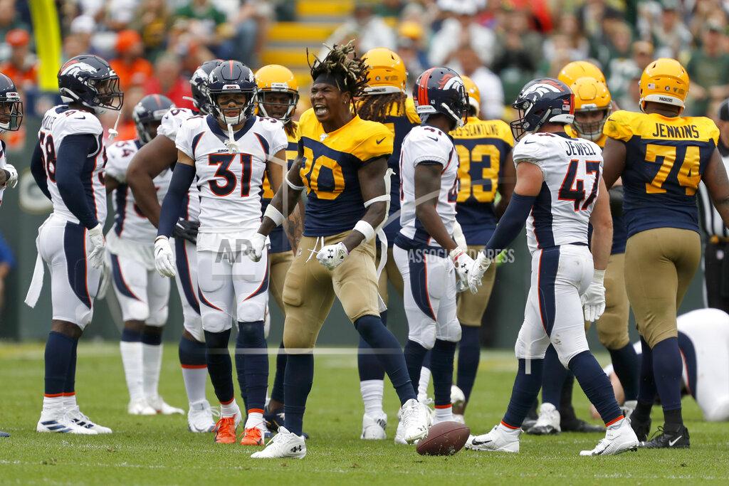 Matt Ludtke Green Bay Packers running back Jamaal Williams (30) celebrates after running for a first down and losing his helmet during the first half of an NFL football game against the Denver Broncos, Sunday, Sept. 22, 2019, in Green Bay, Wis. (AP Photo/Matt Ludtke)