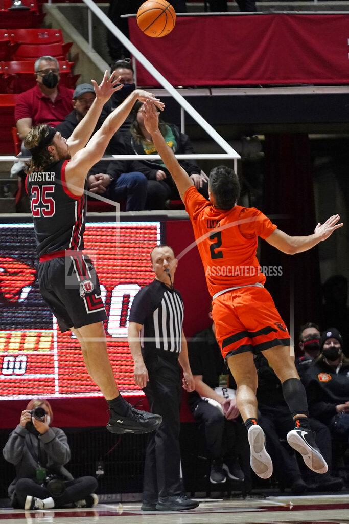 Rick Bowmer Utah guard Rollie Worster (25) shoots as Oregon State guard Jarod Lucas (2) defends in the first half during an NCAA college basketball game Thursday, Feb. 3, 2022, in Salt Lake City. (AP Photo/Rick Bowmer)