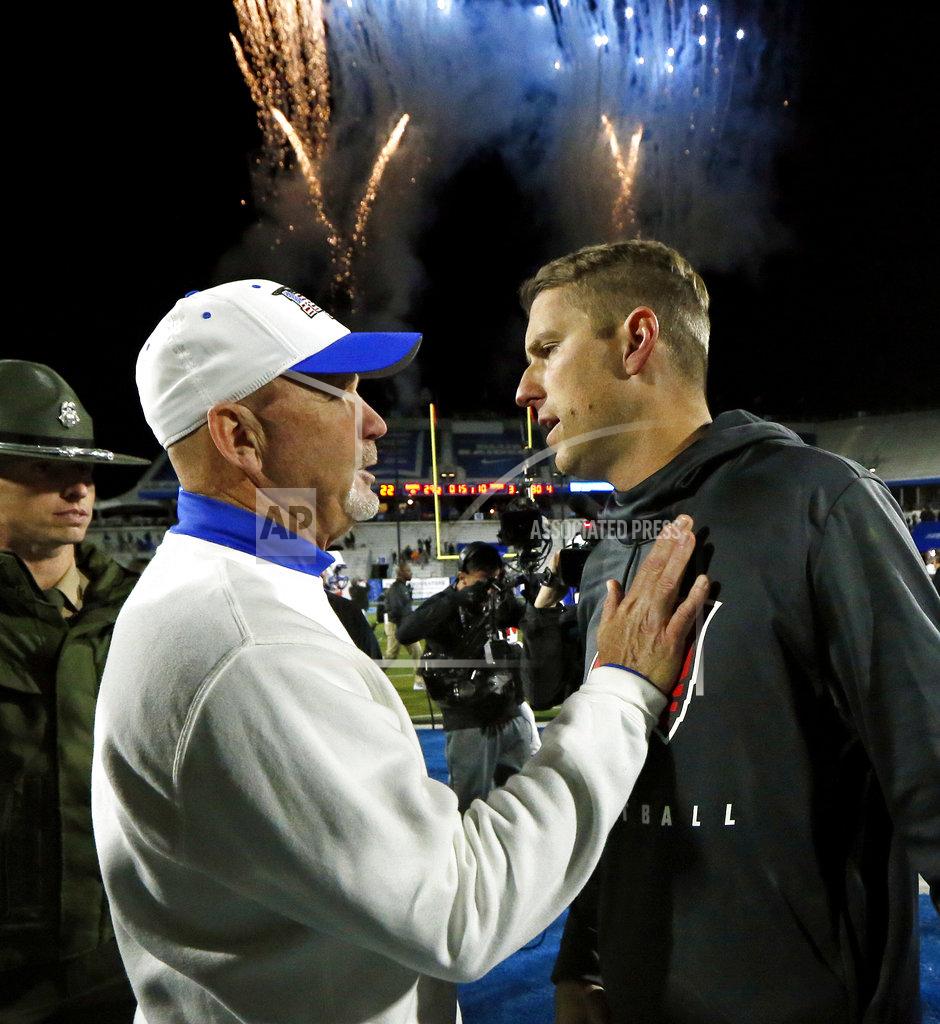 Mark Humphrey Middle Tennessee coach Rick Stockstill, left, talks with Western Kentucky coach Mike Sanford after an NCAA college football game Friday, Nov. 2, 2018, in Murfreesboro, Tenn. Middle Tennessee won 29-10. (AP Photo/Mark Humphrey)