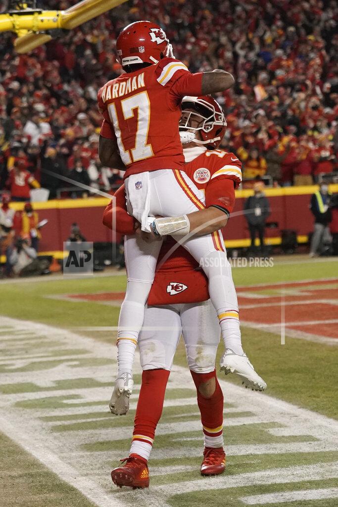 Charlie Riedel Kansas City Chiefs wide receiver Mecole Hardman (17) celebrates with teammate Patrick Mahomes after scoring on a 25-yard touchdown run during the second half of an NFL divisional round playoff football game against the Buffalo Bills, Sunday, Jan. 23, 2022, in Kansas City, Mo. (AP Photo/Charlie Riedel)
