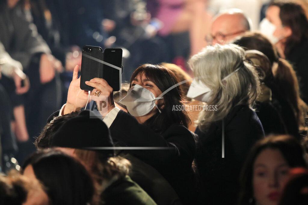 Michel Euler FILE - In this Feb. 27, 2020 file photo, spectators wear protective masks during the Isabel Marant fashion collection during Women's fashion week Fall/Winter 2020/21 presented in Paris. The coronavirus pandemic has instilled extra unpredictability into the already fickle Paris Fashion Week. After first canceling the July shows for menswear and Haute Couture, the French fashion federation has now organized an unprecedented schedule of digital-only events instead. (AP Photo/Michel Euler, File)