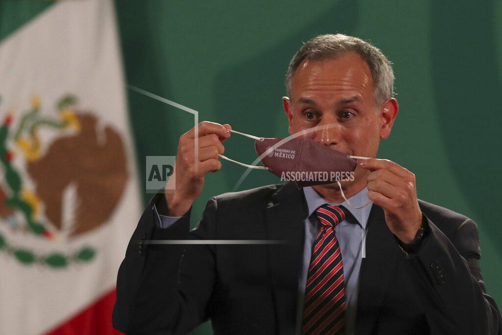 Marco Ugarte Mexico's assistant health secretary Hugo Lopez-Gatell removes his protective face mask during his last daily press conference to address COVID-19, at the National Palace in Mexico City, Friday, June 11, 2021. (AP Photo/Marco Ugarte)