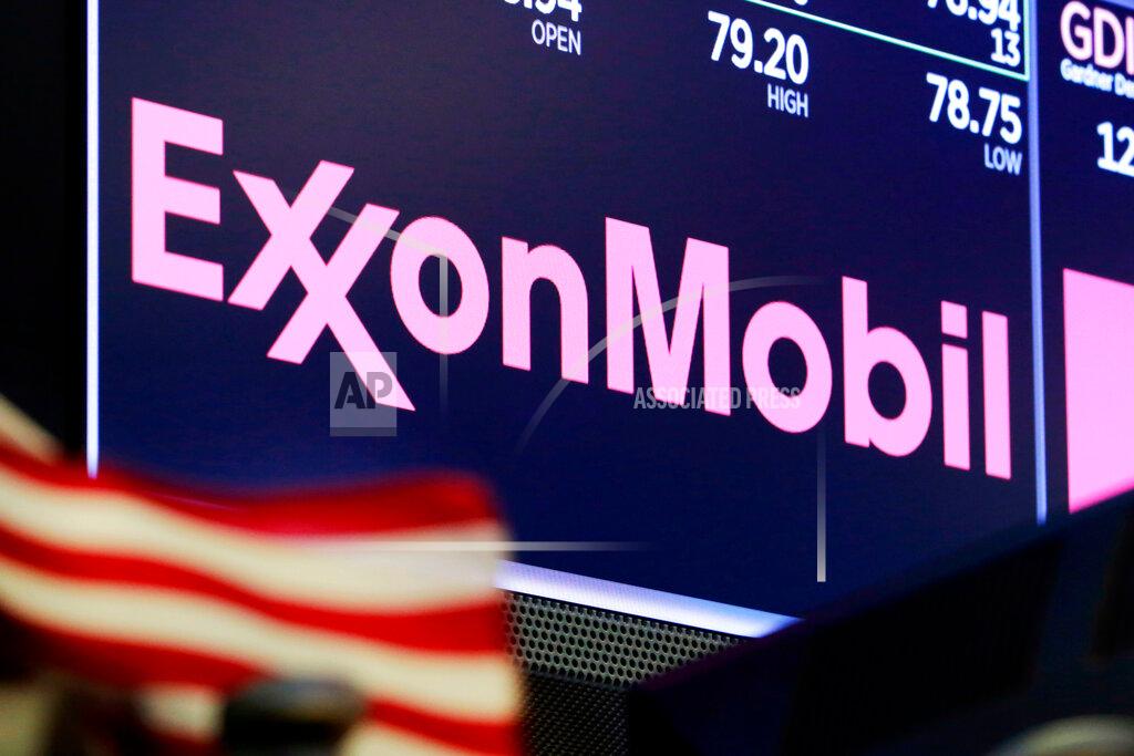 FILE - In this April 23, 2018, file photo, the logo for ExxonMobil appears above a trading post on the floor of the New York Stock Exchange. Exxon lost $1.1 billion in the second quarter, Friday, July 31, 2020, its economic pain deepening as the pandemic kept households on lockdown, diminishing the need for oil around the world. (AP Photo/Richard Drew, File)