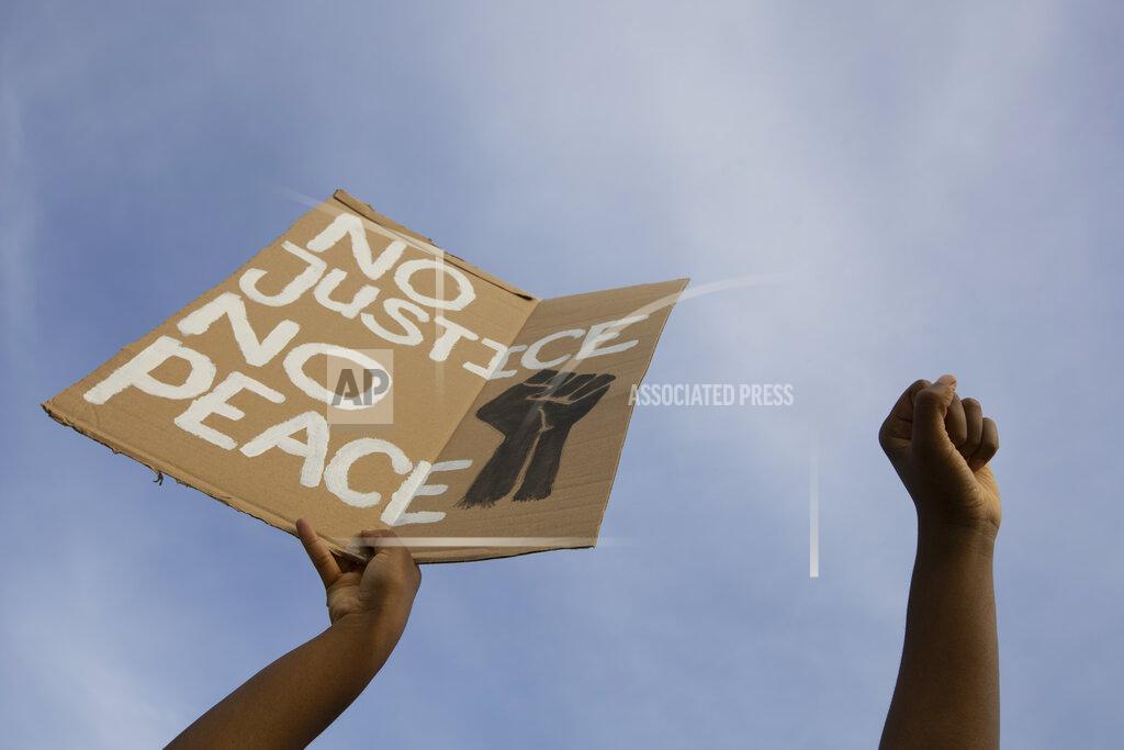 Peter Dejong People take part in a demonstration in The Hague, Netherlands, Tuesday, June 2, 2020, to protest against the recent killing of George Floyd, police violence and institutionalized racism. Floyd, a black man, died in police custody in Minneapolis, U.S.A., after being restrained by police officers on Memorial Day. (AP Photo/Peter Dejong)