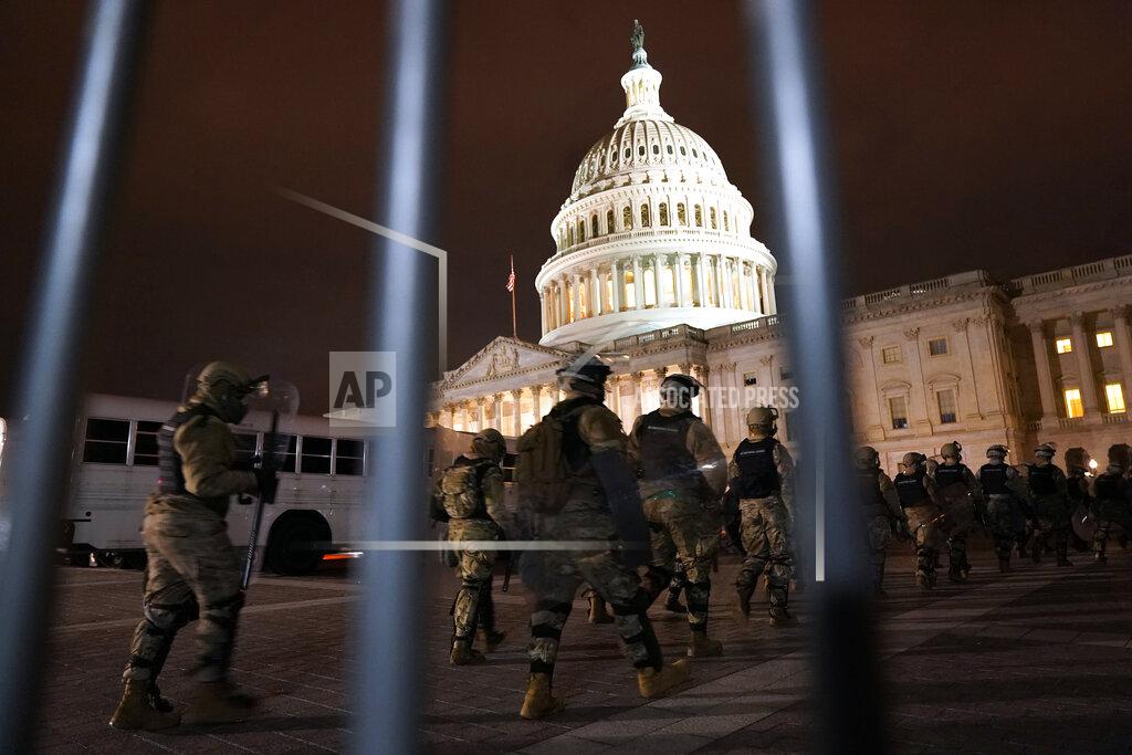 Jacquelyn Martin Members of the National Guard arrive to secure the area outside the U.S. Capitol, Wednesday, Jan. 6, 2021, in Washington. (AP Photo/Jacquelyn Martin)