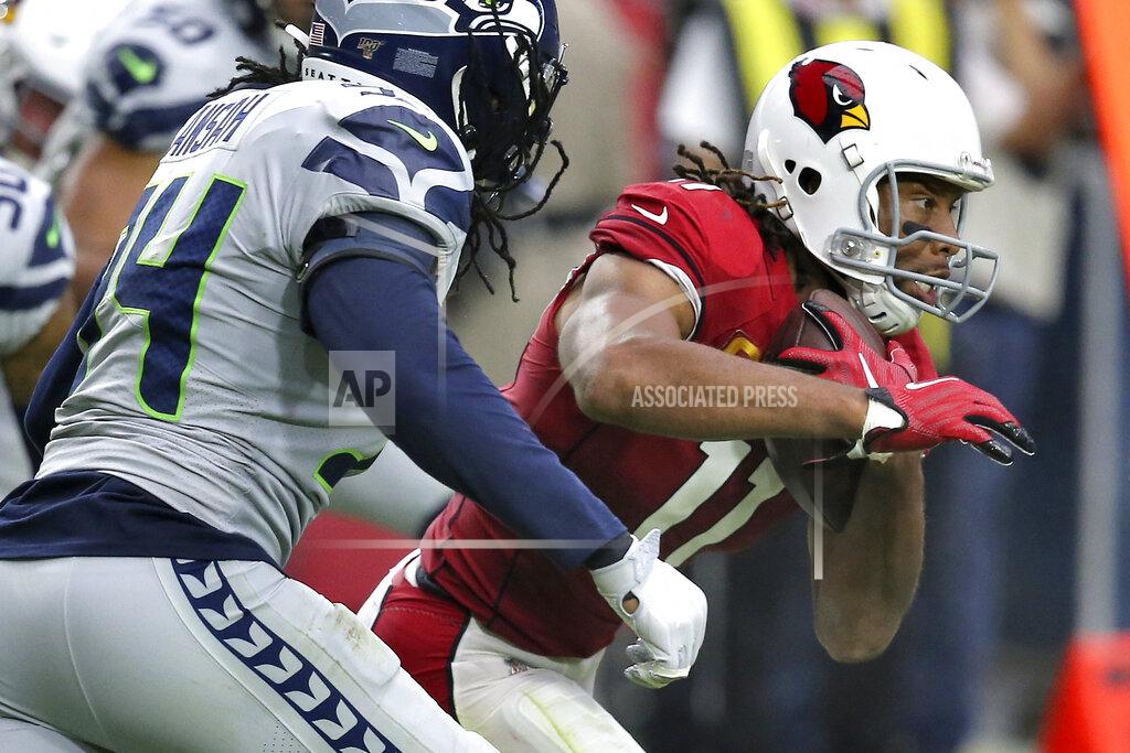 Ross D. Franklin Arizona Cardinals wide receiver Larry Fitzgerald (11) runs as Seattle Seahawks defensive end Ezekiel Ansah defends during the second half of an NFL football game, Sunday, Sept. 29, 2019, in Glendale, Ariz. (AP Photo/Ross D. Franklin)