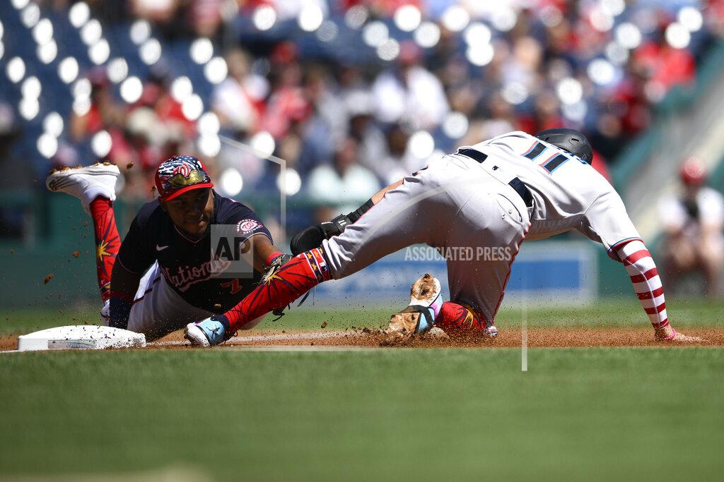 Nick Wass Miami Marlins' Miguel Rojas (11) is out at third by Washington Nationals third baseman Maikel Franco, left, on a single by Marlins' Brian Anderson during the first inning of a baseball game, Monday, July 4, 2022, in Washington. (AP Photo/Nick Wass)