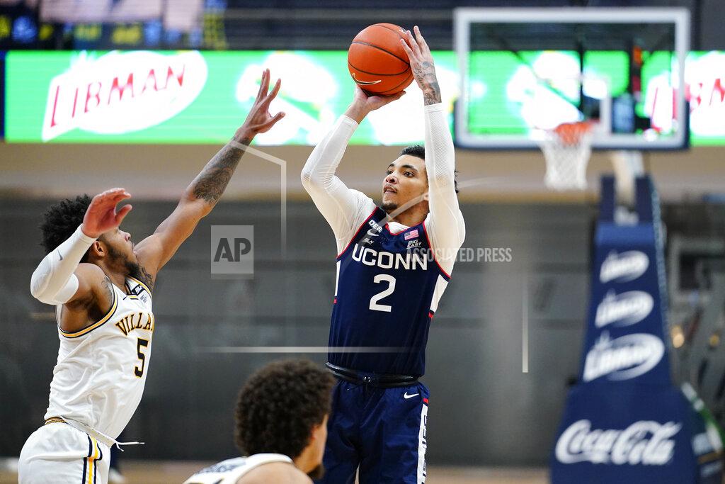 Matt Slocum Connecticut's James Bouknight (2) goes up for a shot against Villanova's Justin Moore (5) during the second half of an NCAA college basketball game, Saturday, Feb. 20, 2021, in Villanova, Pa. (AP Photo/Matt Slocum)