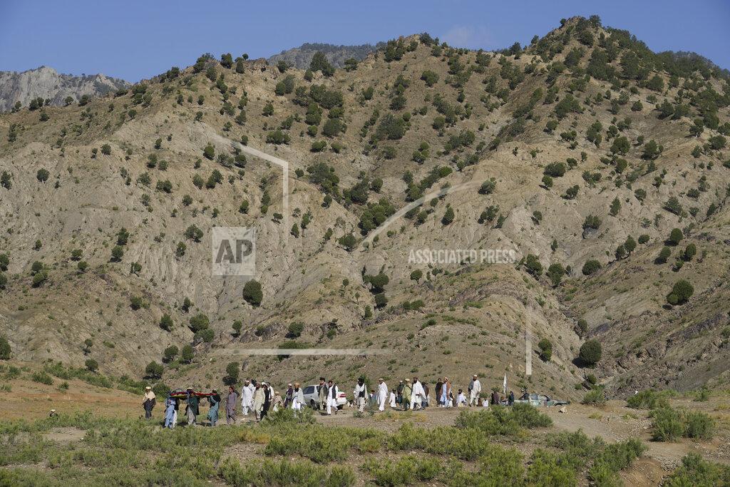 Ebrahim Noroozi Afghans carry a relative killed in an earthquake to a burial site l in Gayan village, in Paktika province, Afghanistan, Thursday, June 23, 2022. A powerful earthquake struck a rugged, mountainous region of eastern Afghanistan early Wednesday, flattening stone and mud-brick homes in the country's deadliest quake in two decades, the state-run news agency reported. (AP Photo/Ebrahim Nooroozi)