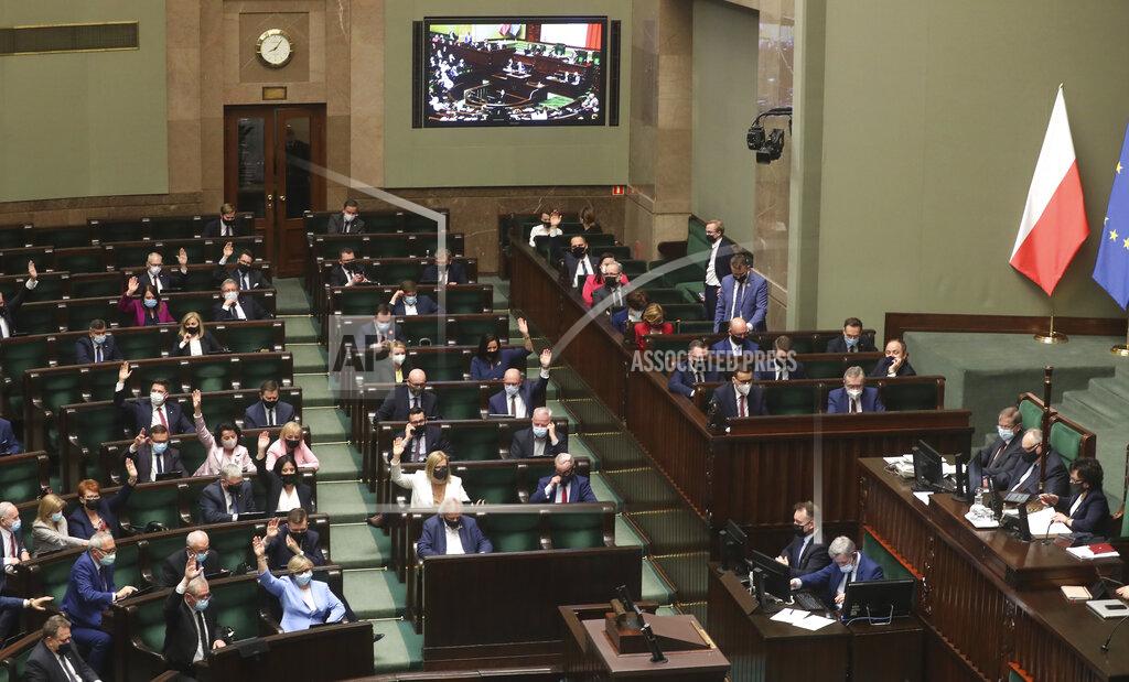 Czarek Sokolowski Poland's lawmakers during voting – some in parliament, some remotely – in Warsaw, Poland, on Tuesday, May 4, 2021. Polish lawmakers have voted to approve the nation’s spending plan for the 58 billion euros ($70 billion) it expects to receive from the European Union’s pandemic recovery plan. (AP Photo/Czarek Sokolowski)