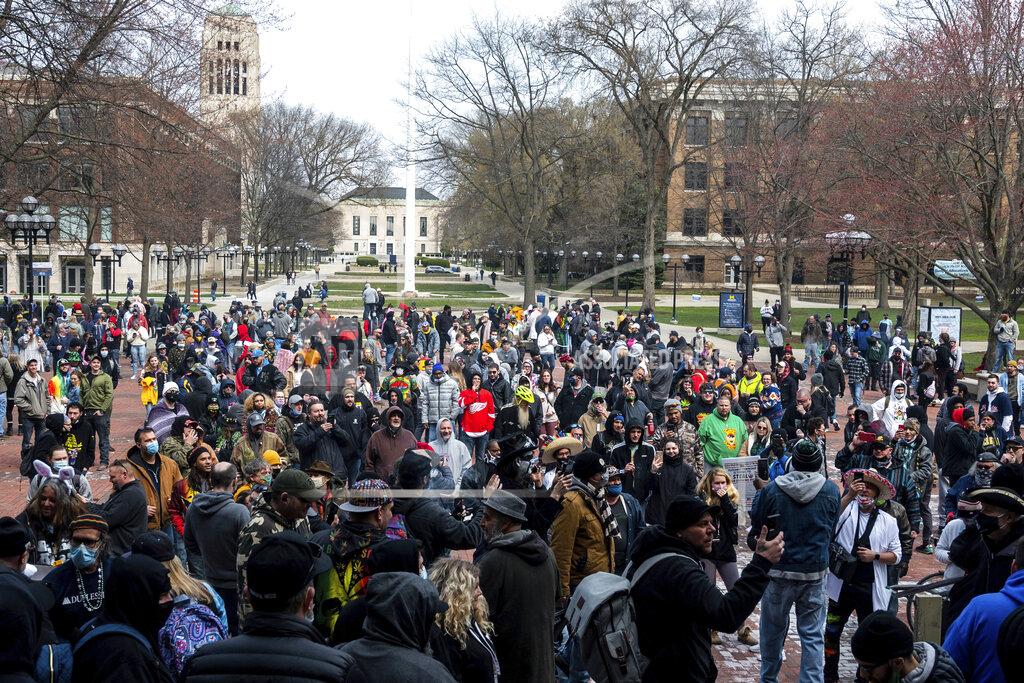 Jacob Hamilton Attendees gather at a Hash Bash event at the University of Michigan in Ann Arbor, Mich., Saturday, April 3, 2021.( Jacob Hamilton/Ann Arbor News via AP)