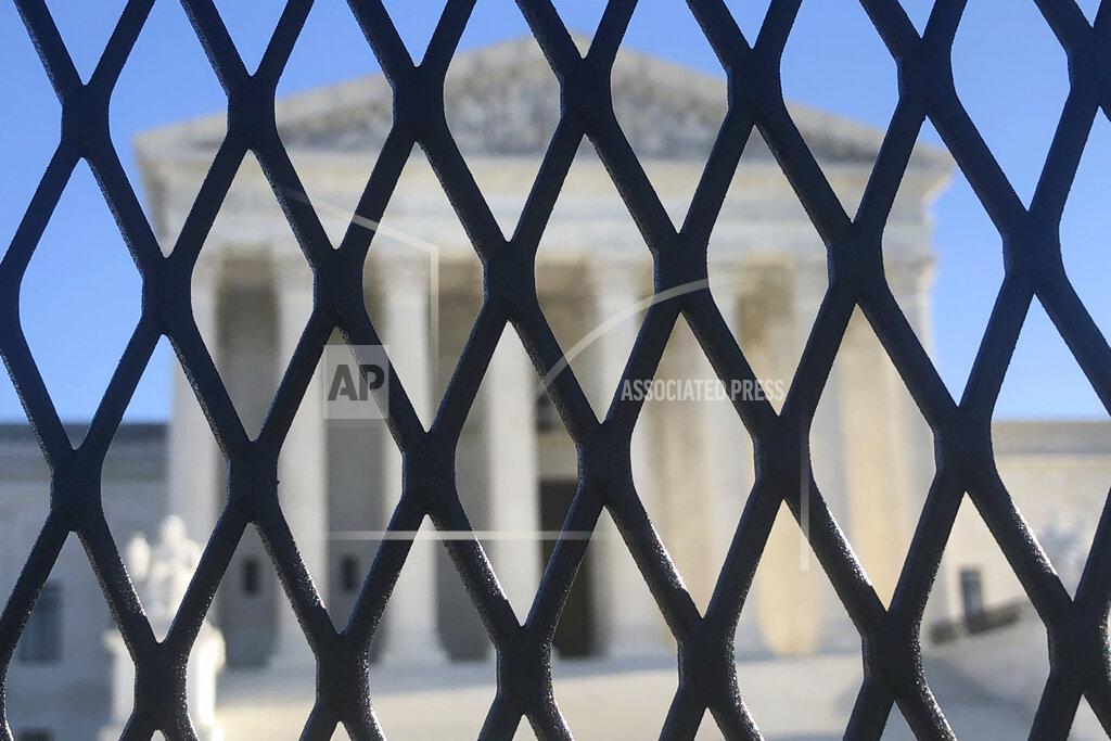 Alan Fram Anti-scaling fencing has been placed in front of the Supreme Court, which stands across the street from the U.S. Capitol, Sunday, Jan. 10, 2021, in Washington. (AP Photo/Alan Fram)