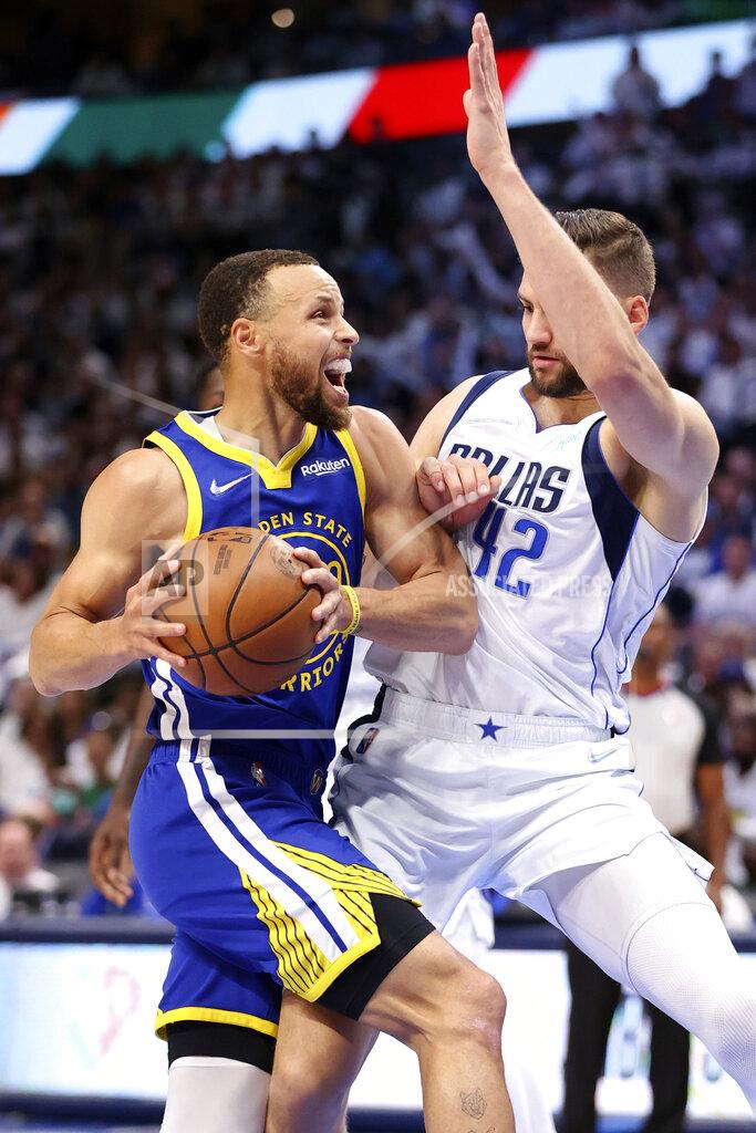 Scott Strazzante Golden State Warriors' Stephen Curry drives against Dallas Mavericks' Maxi Kleber during the first half of Game 4 of the NBA basketball playoffs Western Conference finals Tuesday, May 24, 2022, in Dallas. (Scott Strazzante/San Francisco Chronicle via AP)