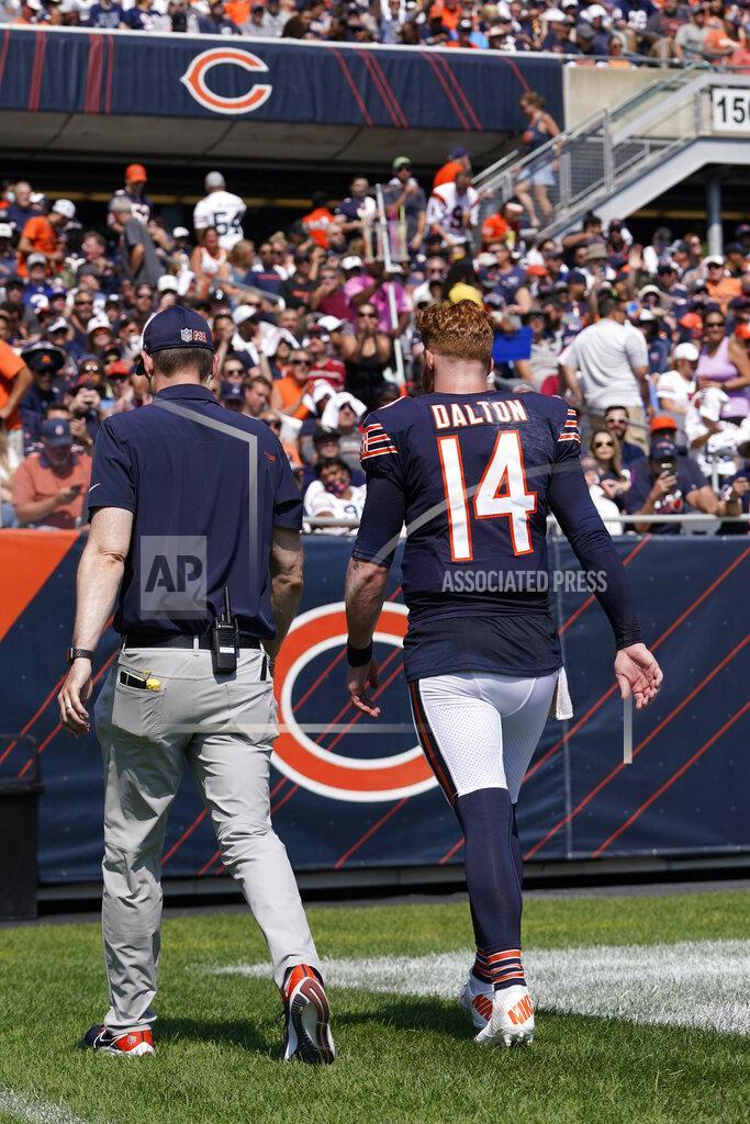 Nam Y. Huh Chicago Bears quarterback Andy Dalton walks to the locker room with an unidentified trainer during the first half of an NFL football game against the Cincinnati Bengals Sunday, Sept. 19, 2021, in Chicago. (AP Photo/Nam Y. Huh)