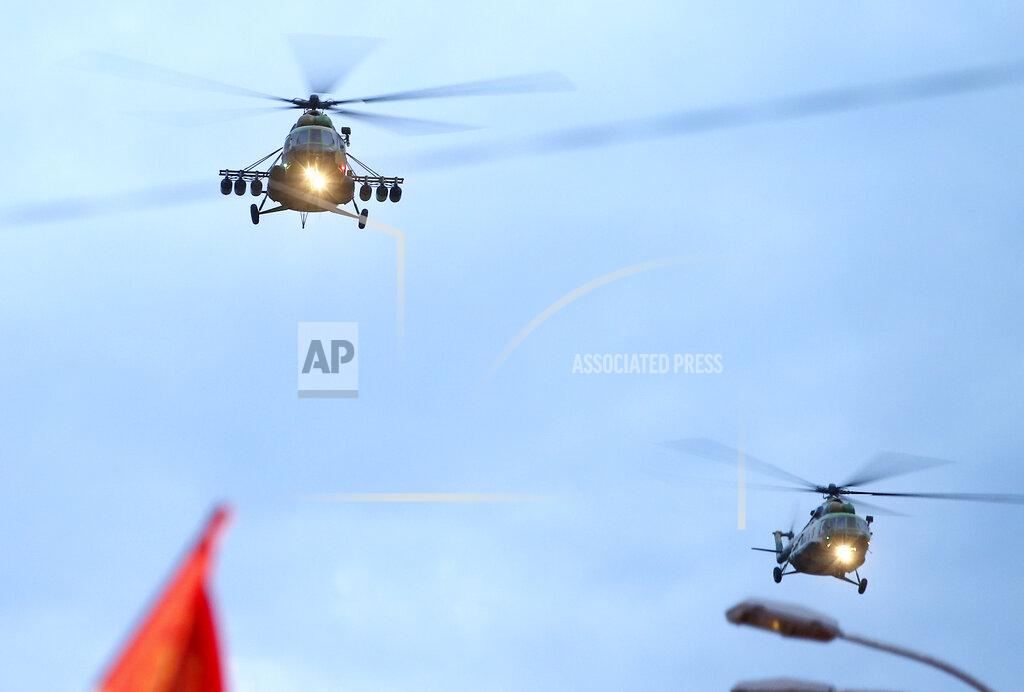Boris Grdanoski Army helicopters fly over during a parade to mark the Independence Day in downtown Skopje, North Macedonia, Wednesday, Sept. 8, 2021. North Macedonia is celebrating Wednesday the 30th anniversary since its independence from former Yugoslavia. (AP Photo/Boris Grdanoski)