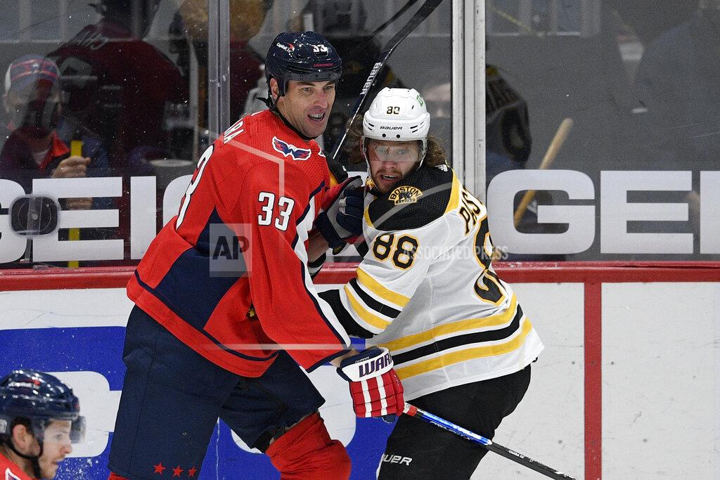 Nick Wass Washington Capitals defenseman Zdeno Chara (33) and Boston Bruins right wing David Pastrnak (88) battle for position during the first period of an NHL hockey game, Saturday, Jan. 30, 2021, in Washington. (AP Photo/Nick Wass)