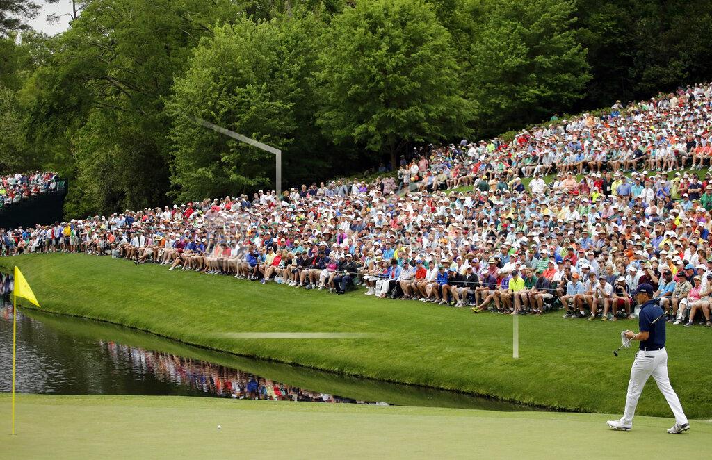 Matt Slocum FILE - Jordan Spieth waits to putt on the 16th hole during the fourth round of the Masters golf tournament in Augusta, Ga., in this Sunday, April 12, 2015, file photo. The hole is one of the largest gathering spots on the course. For this Masters in November, there will be no spectators. (AP Photo/Matt Slocum, File)