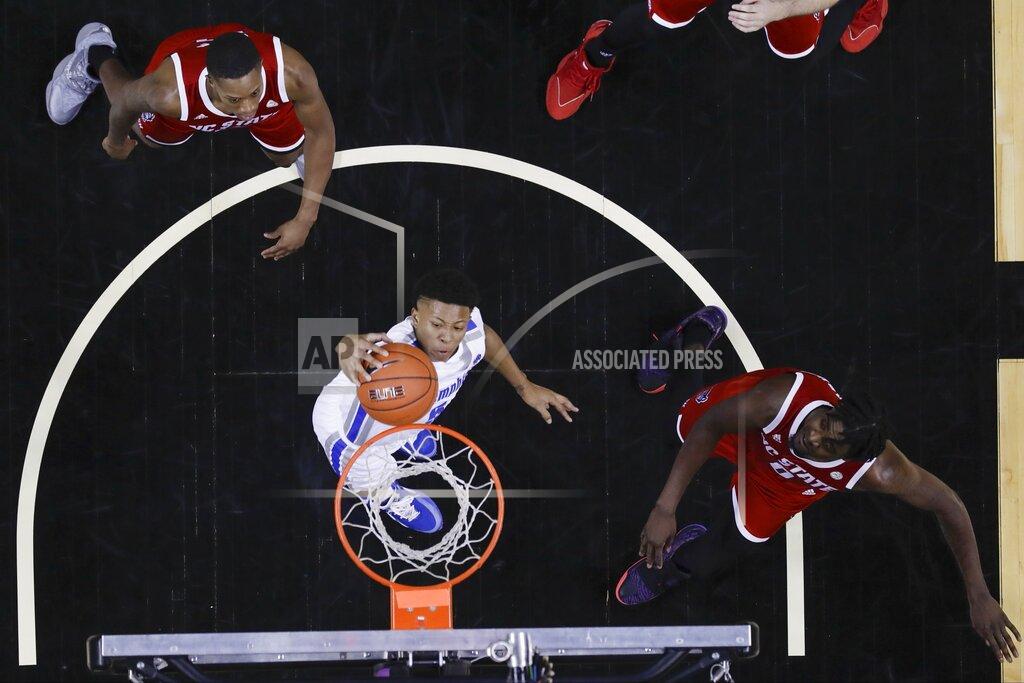 Frank Franklin Ii Memphis' Boogie Ellis (5) dunks in front of North Carolina State's DJ Funderburk (0) and C.J. Bryce during the first half of an NCAA college basketball game in the Barclays Classic, Thursday, Nov. 28, 2019, in New York. (AP Photo/Frank Franklin II)