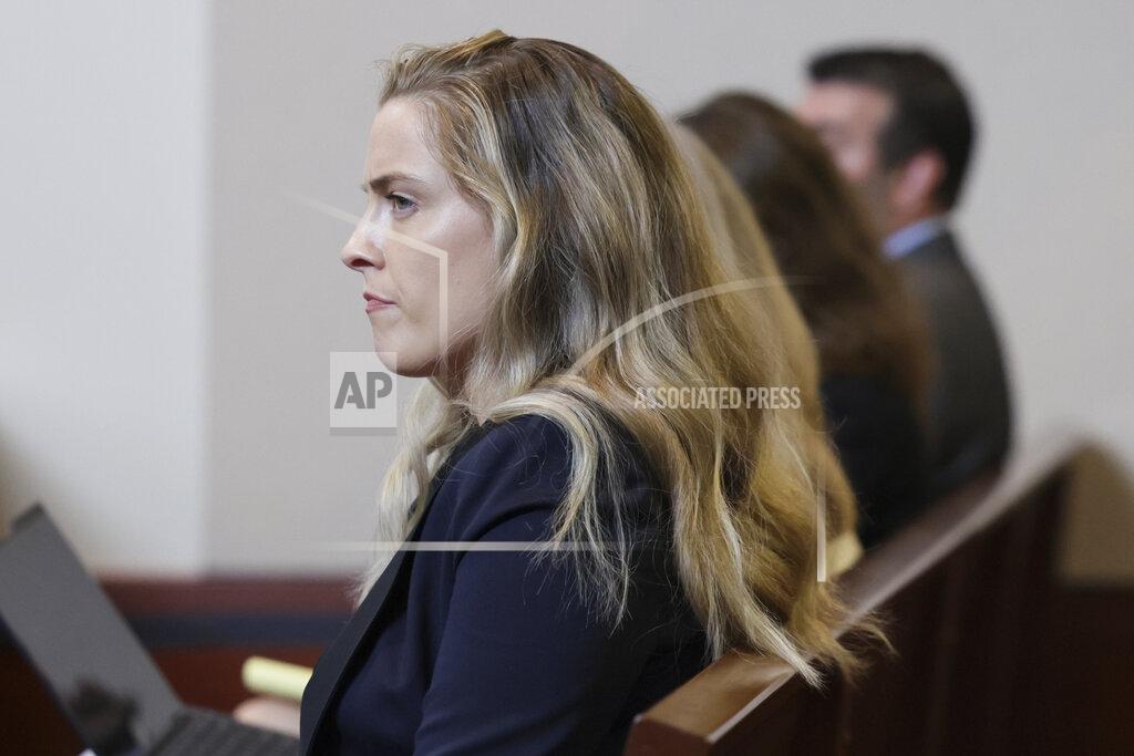 Evelyn Hockstein Whitney Henriquez, sister of actor Amber Heard, sits in the courtroom at the Fairfax County Circuit Courthouse in Fairfax, Va., Wednesday, May 25, 2022. Actor Johnny Depp sued his ex-wife Amber Heard for libel in Fairfax County Circuit Court after she wrote an op-ed piece in The Washington Post in 2018 referring to herself as a "public figure representing domestic abuse." (Evelyn Hockstein/Pool photo via AP)