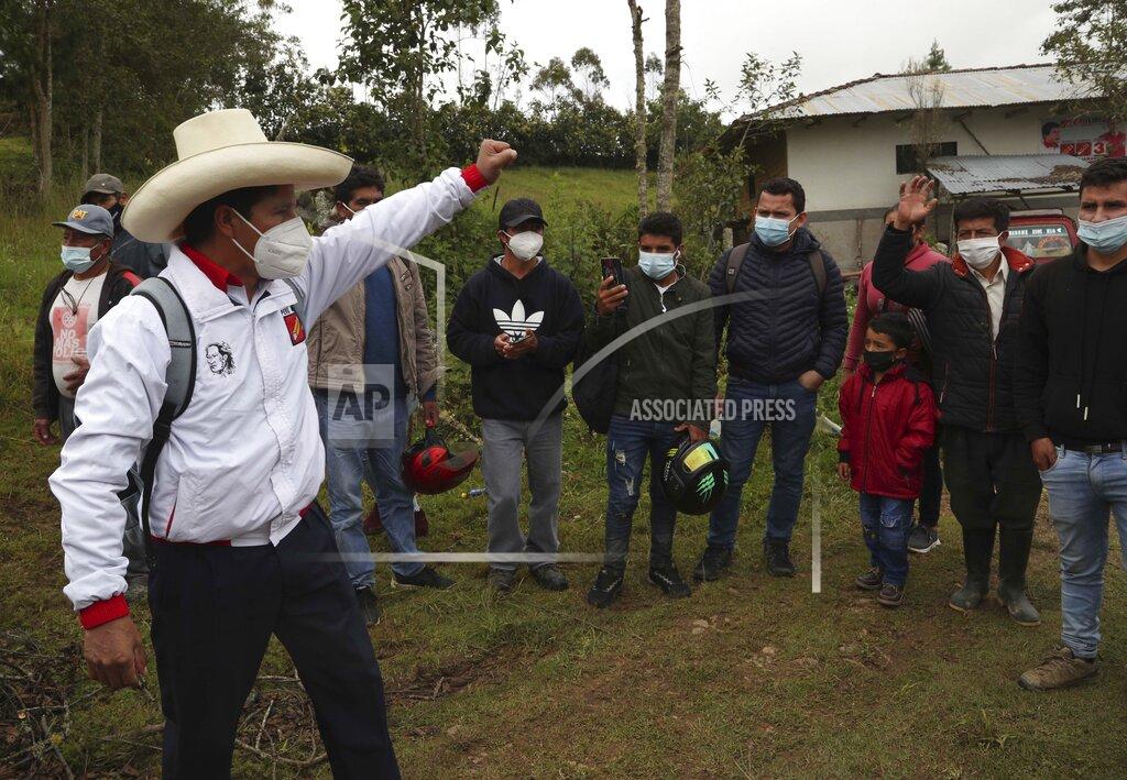 Martin Mejia Free Peru party presidential candidate Pedro Castillo says goodbye to his neighbors as he leaves his home to prepare for his electoral campaign, in Chugur, Peru, Friday, April 16, 2021. Castillo, a rural teacher, who has proposed rewriting Peru's constitution and deporting all immigrants living in the country illegally who commit crimes, will face rival candidate Keiko Fujimori in the June 6 presidential run-off election. (AP Photo/Martin Mejia)