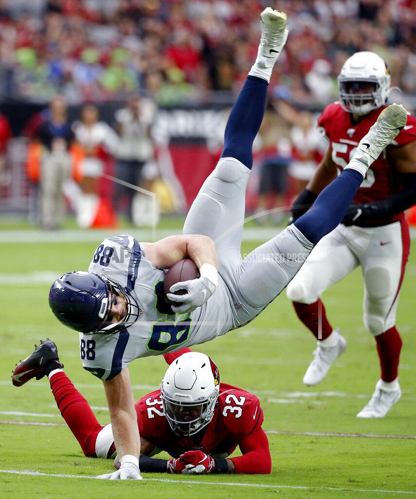 Rick Scuteri Seattle Seahawks tight end Will Dissly (88) is tackled by Arizona Cardinals strong safety Budda Baker (32) during the first half of an NFL football game, Sunday, Sept. 29, 2019, in Glendale, Ariz. (AP Photo/Rick Scuteri)