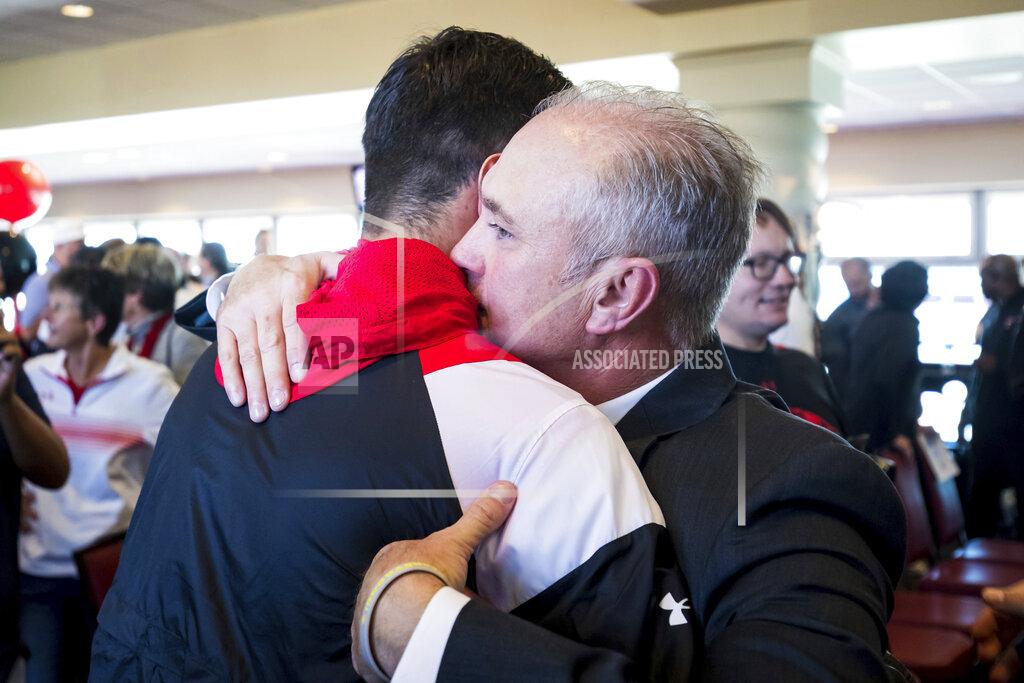John Moore New Texas Tech head football coach Joey McGuire greets quarterback Behren Morton after an NCAA college football news conference, Tuesday, Nov. 9, 2021, at Jones AT&T Stadium in Lubbock, Texas. (John Moore/Lubbock Avalanche-Journal via AP)
