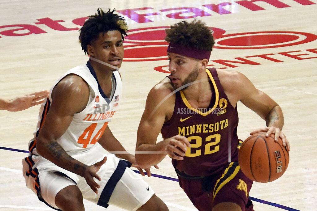 Holly Hart Illinois guard Adam Miller (44) pressures Minnesota's guard Gabe Kalscheur (22) in the first half of an NCAA college basketball game Tuesday, Dec. 15, 2020, in Champaign, Ill. (AP Photo/Holly Hart)