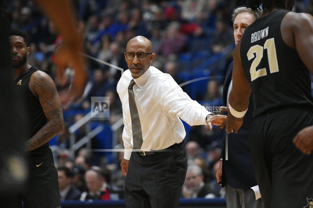 Jessica Hill Central Florida head coach Johnny Dawkins greets his players during a time out in the first half of an NCAA college basketball game against Connecticut, Saturday, Jan. 5, 2019, in Hartford, Conn. (AP Photo/Jessica Hill)