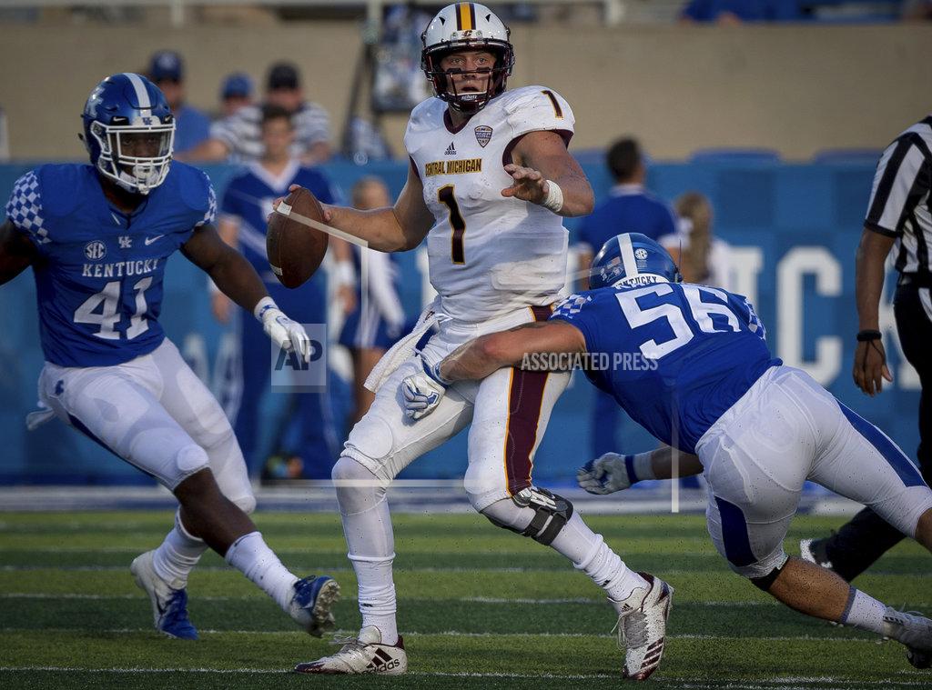 Bryan Woolston Central Michigan quarterback Tony Poljan (1) is tackled by Kentucky linebacker Kash Daniel (56) during the second half of an NCAA college football game in Lexington, Ky., Saturday, Sept. 1, 2018. (AP Photo/Bryan Woolston)