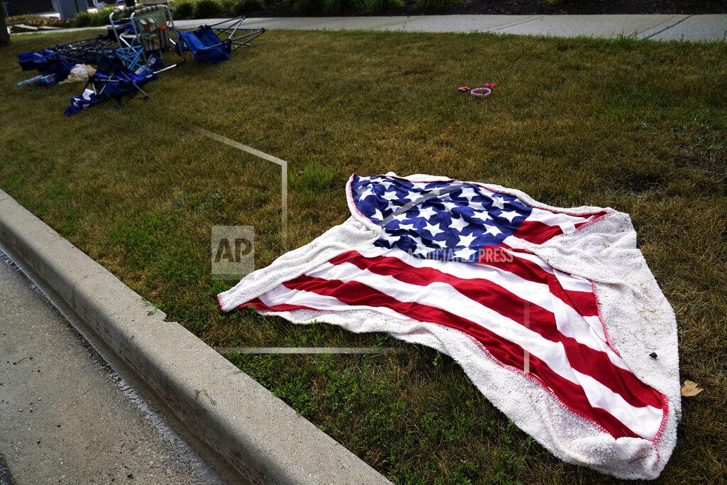 Nam Y. Huh Empty chairs and an American flag blanket lie on the ground after a mass shooting at the Highland Park Fourth of July parade in downtown Highland Park, a Chicago suburb on Monday, July 4, 2022. (AP Photo/Nam Y. Huh)