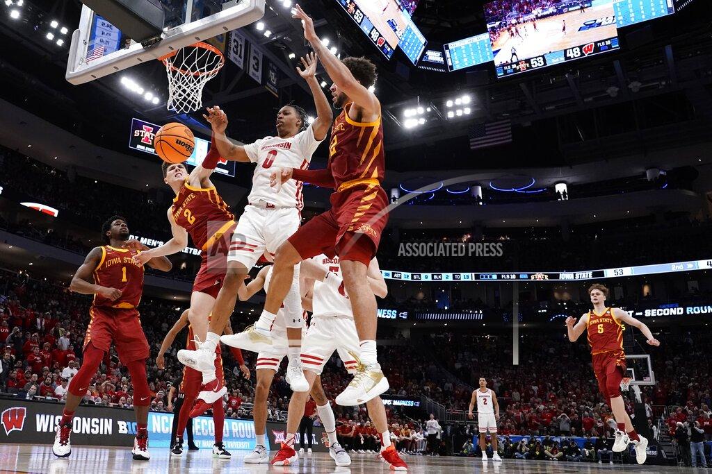 Morry Gash Wisconsin's Jahcobi Neath loses the ball between Iowa State's Caleb Grill and Gabe Kalscheur during the second half of a second-round NCAA college basketball tournament game Sunday, March 20, 2022, in Milwaukee. (AP Photo/Morry Gash)