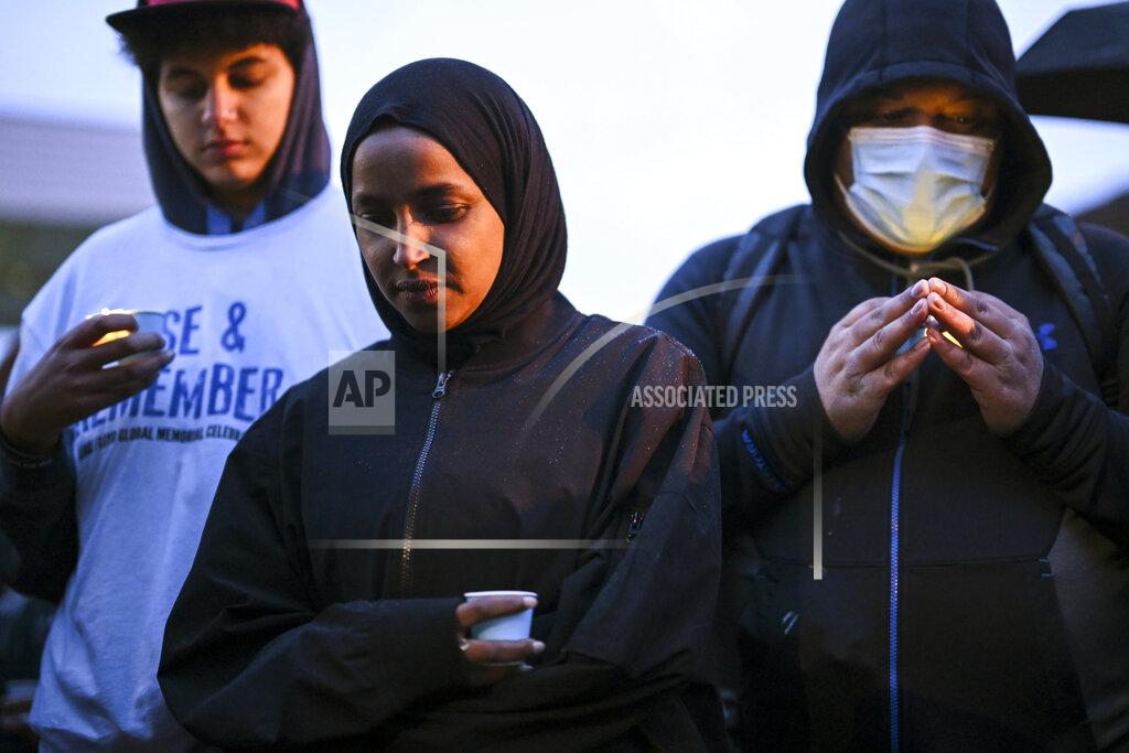 Aaron Lavinsky U.S. Rep. Ilhan Omar bows her head in a moment of silence at George Floyd Square Wednesday, May 25, 2022, in Minneapolis. The intersection where Floyd died at the hands of Minneapolis police officers was renamed in his honor Wednesday, among a series of events to remember a man whose killing forced America to confront racial injustice. (Aaron Lavinsky/Star Tribune via AP)