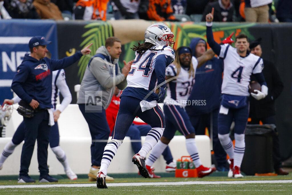 Frank Victores New England Patriots cornerback Stephon Gilmore (24) runs in a touchdown off an interception in the second half of an NFL football game against the Cincinnati Bengals, Sunday, Dec. 15, 2019, in Cincinnati. (AP Photo/Frank Victores)
