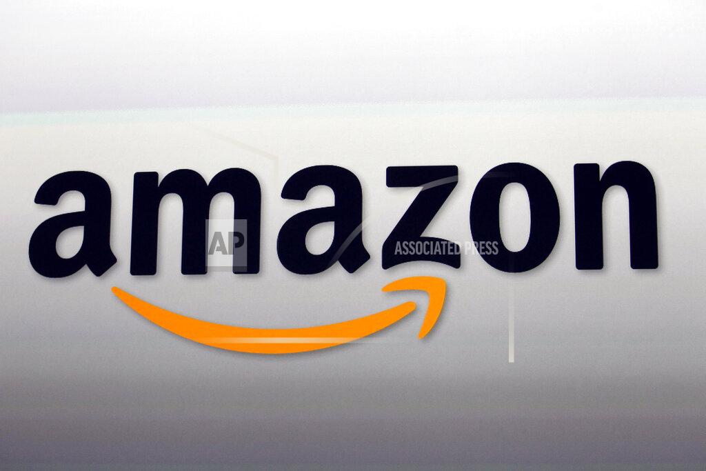 Reed Saxon FILE - This Sept. 6, 2012, file photo, shows the Amazon logo in Santa Monica, Calif. After the U.S. Supreme Court revoked the federal right to an abortion that's been in place for half a century, companies like Amazon, Disney, Apple and JP Morgan pledged to cover travel costs for employees who live in states where the procedure is now illegal so they can terminate pregnancies. (AP Photo/Reed Saxon, File)