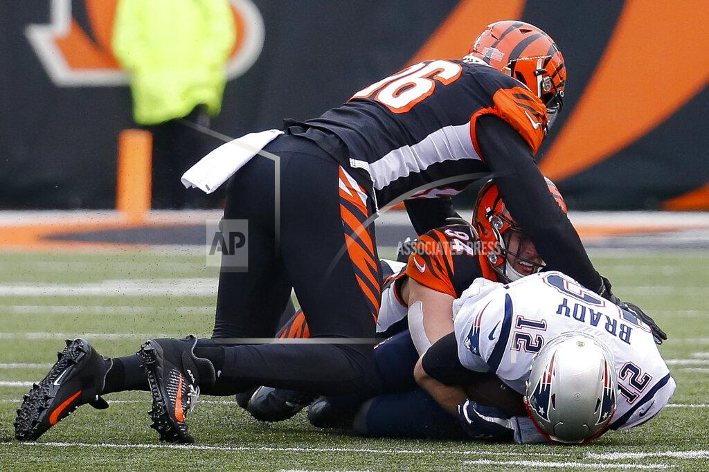 Frank Victores New England Patriots quarterback Tom Brady (12) is sacked by Cincinnati Bengals defensive end Sam Hubbard (94) in the first half of an NFL football game, Sunday, Dec. 15, 2019, in Cincinnati. (AP Photo/Frank Victores)