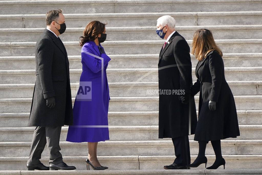 J. Scott Applewhite Vice President Kamala Harris and her husband Doug Emhoffl left, and former Vice President Mike Pence and his wife Karen Pence speak before the Pence's depart the Capitol after the Inauguration of President Joe Biden ceremony on the East Front of the Capitol at the conclusion of the inauguration ceremonies, in Washington, Wednesday, Jan. 20, 2021. (AP Photo/J. Scott Applewhite)