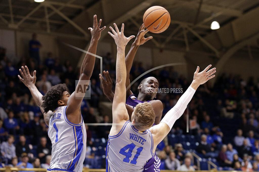Gerry Broome Central Arkansas guard Collin Cooper passes as Duke center Vernon Carey Jr. (1) and forward Jack White (41) guard during the half of an NCAA college basketball game in Durham, N.C., Tuesday, Nov. 12, 2019. (AP Photo/Gerry Broome)