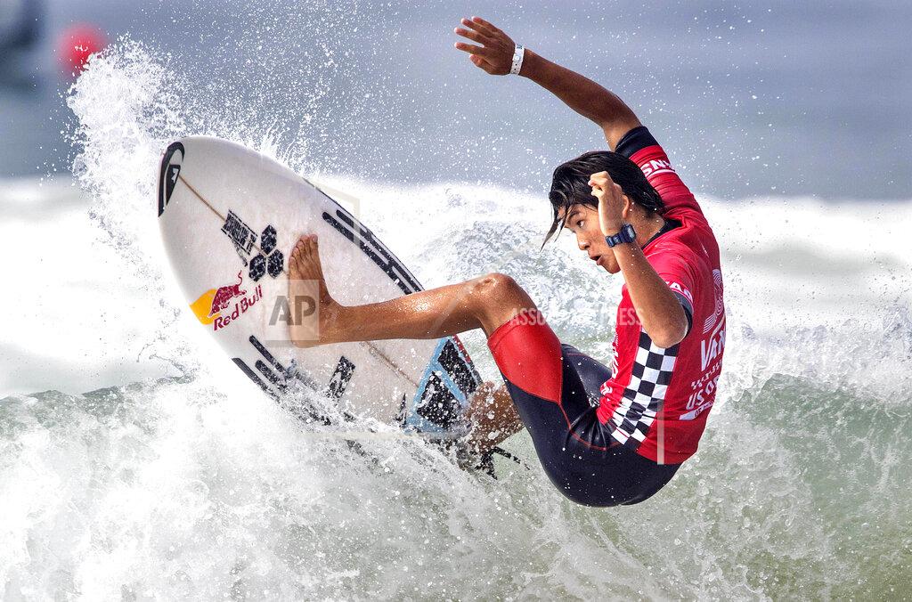 Mark Rightmire FILE - In this Aug. 4, 2017, file photo, Kanoa Igarashi, of Huntington Beach, Calif., rides a wave during the U.S. Open of Surfing competition in Huntington Beach, Calif. The Vans U.S. Open of Surfing, a summer competition that draws thousands each year to Southern California's Huntington Beach, has been canceled because of the coronavirus. Organizers announced the cancellation on Monday, June 15, 2020 citing "continued health concerns and current guidelines surrounding the COVID-19 pandemic." (Mark Rightmire/The Orange County Register via AP)