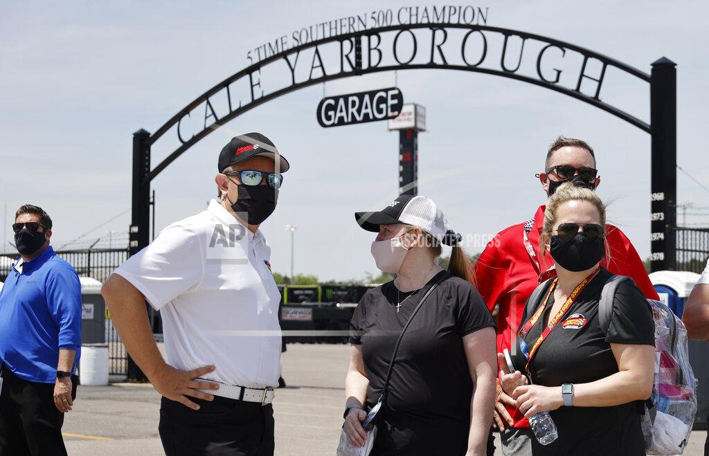 Terry Renna Fans check out activity in the garage area before a NASCAR Cup Series auto race at Darlington Raceway, Sunday, May 9, 2021, in Darlington, S.C. It is the first time this year that fans are allowed back in the garage area. (AP Photo/Terry Renna)