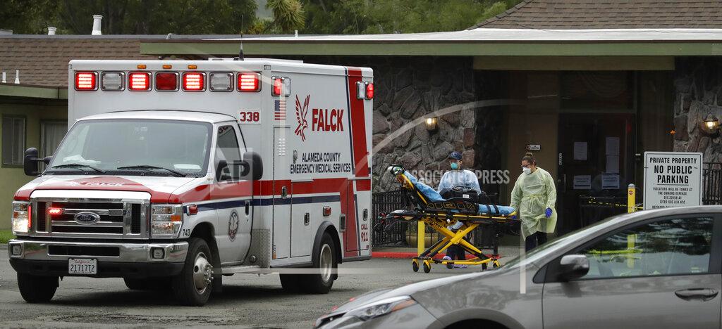 EMT's move a stretcher at the Gateway Care and Rehabilitation Center on Thursday, April 9, 2020, in Hayward, Calif. (AP Photo/Ben Margot)